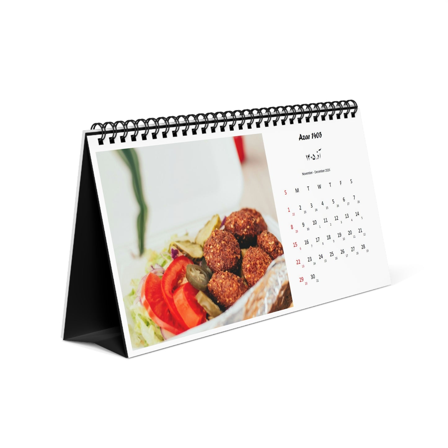 Tabletop persian calendar with falafel image on a white background